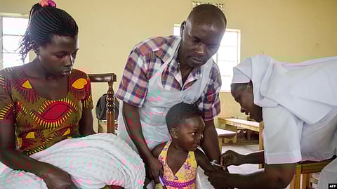 A girl receives an injection during a nationwide vaccination campaign against measles, rubella and polio targeting all children under 15 years old in Nkozi, about 84 km from Kampala, Uganda, on Oct. 19, 2019.