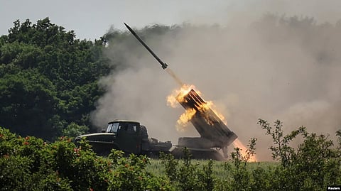 Ukrainian service members fire a multiple rocket launch system, near the town of Lysychansk, Luhansk region, amid Russia's attack on Ukraine, June 12, 2022.