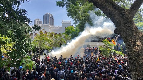Demonstrators gather outside the office of Sri Lanka's Prime Minister Ranil Wickremesinghe, amid the country's economic crisis, in Colombo, July 13, 2022.