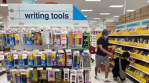 Shoppers look for school supplies deals at a Target store, Wednesday, July 27, 2022, in South Miami, Fla.
