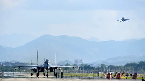 In this photo released by China's Xinhua News Agency, air force and naval aviation corps of the Eastern Theater Command of the Chinese People's Liberation Army (PLA) fly planes at an unspecified location in China, Aug. 4, 2022.