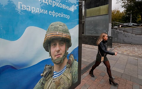 A Moscow recruitment poster bears the slogan "Glory to the Heroes of Russia" in order to attract people to fight in the Russia-Ukraine War.