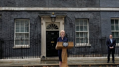 New British Prime Minister Liz Truss speaks outside Downing Street as her husband, Hugh O'Leary, listens, in London, Sept. 6, 2022 after returning from Balmoral in Scotland where she was formally appointed by Britain's Queen Elizabeth II. (AP via VOA)