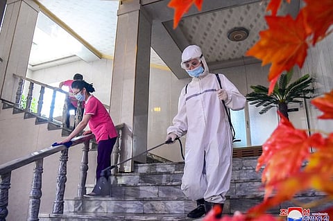 Staff members disinfect a Pyongyang hotel in this image released by North Korea's official Korean Central News Agency (KCNA) on July 2, 2022 - about a month and a half before Kim Jong Un declared an end to “maximum emergency” COVID-19 restrictions.