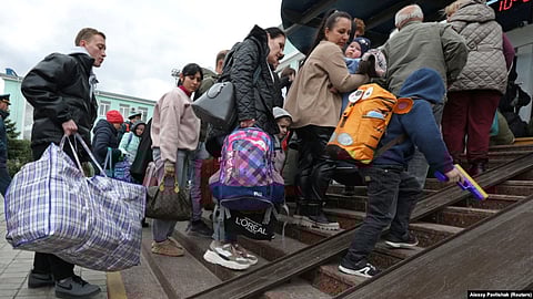 Civilians evacuated from the Russian-occupied Kherson region of Ukraine arrive at a railway station in the town of Dzhankoi, on the Russia-annexed Crimean Peninsula, on October 20.