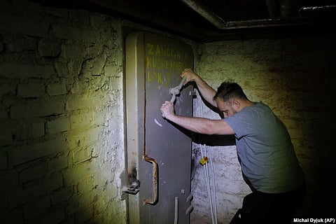Jacek, 37, closes a door to a shelter in the basement of a residential building in Warsaw, Poland, on October 19.