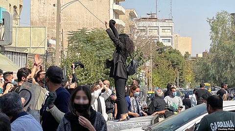 Protesters rally in Tehran on October 2. Iran has seen a rare outburst of sustained public anger, driven in large part by women.