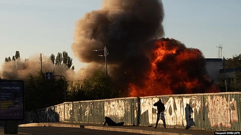 A man falls to the ground following a drone attack in Kyiv, Ukraine on October 17. Kyiv and its Western allies have accused Moscow of using Iranian-made drones in attacks on Ukraine in recent weeks.
