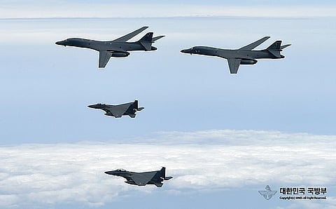 U.S. Air Force B-1B Lancers assigned to the 9th Expeditionary Bomb Squadron, deployed from Dyess Air Force Base, Texas, fly with South Korean F-15 fighter jets over the Korean Peninsula. (File Photo)