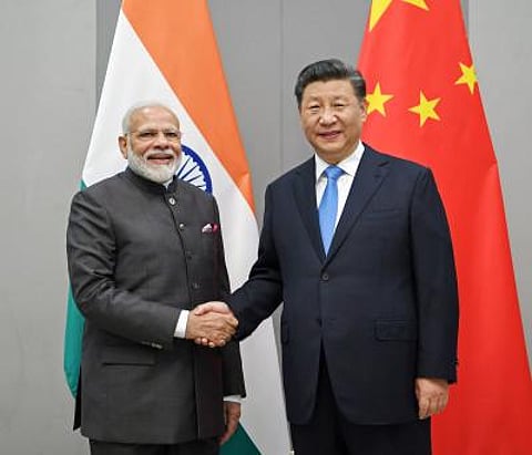 PM Narendra Modi, Chinese President Xi Jinping Shake Hands, Exchanges Pleasantries.