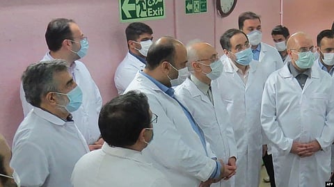 FILE - A handout picture provided by Iran's Atomic Energy Organization shows Iranian Parliament speaker Mohammad Bagher Ghalibaf (R) and the head of the Iranian Atomic Organization Ali Akbar Salehi (L) visiting the Fordo Uranium Conversion Facility, in Iran