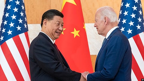 FILE - U.S. President Joe Biden, right, and Chinese President Xi Jinping shake hands before a meeting on the sidelines of the G-20 summit meeting on Nov. 14, 2022, in Bali, Indonesia.