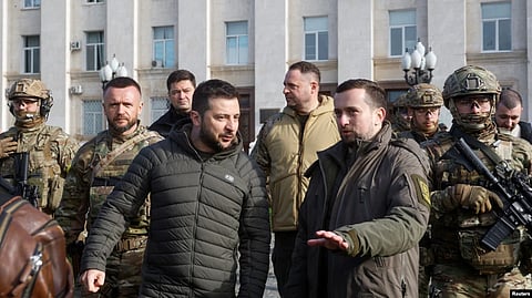 Ukraine's President Volodymyr Zelenskyy walks after a flag rising ceremony as Russia's retreat from Kherson, in central Kherson, Ukraine Nov. 14, 2022.