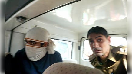 Aftab Ameen Poonawalla (left) in police custody.