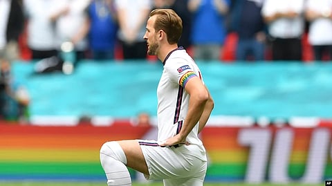 FILE - England's Harry Kane wears a rainbow armband prior to a Euro 2020 soccer championship match at Wembley Stadium. The captains of 7 European nations will not wear anti-discrimination armbands in World Cup games after threats from FIFA to show yellow cards to the players.