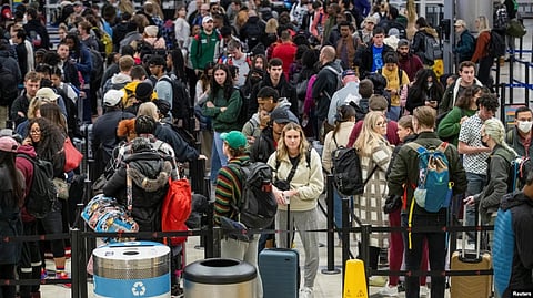 Travelers navigate through a security checkpoint at Hartsfield-Jackson Atlanta International Airport ahead of the Thanksgiving holiday in Atlanta, Georgia, Nov. 22, 2022.