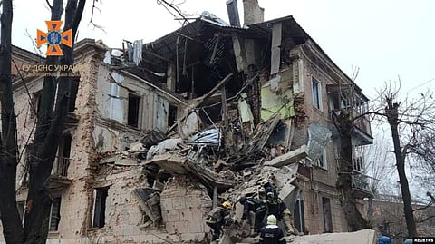 Rescuers work at the site of a residential building damaged by a Russian missile amid their attack on Ukraine, in Kryvyi Rih, Ukraine December 16, 2022. (Reuters)