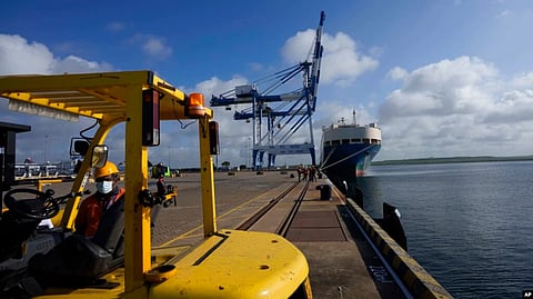 FILE - A Sri Lankan port worker stands on jetty at the Chinese-run International Port in Hambantota, Sri Lanka, Aug. 16, 2022. (AP)
