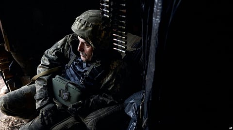 A Ukrainian soldier sits in his position during fights with Russian forces near Maryinka, Donetsk region, Ukraine, Dec. 23, 2022. (AP)