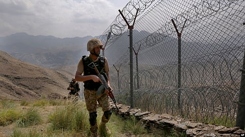 FILE - In this Aug. 3, 2021 file photo, Pakistan Army troops patrol the Pakistan-Afghanistan border. Pakistan warned Dec. 1, 2022, that cross-border terrorism emanating from Afghanistan “is both alarming and dangerous” for regional peace. (AP)