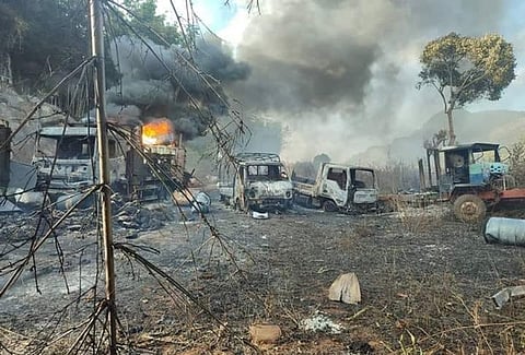 Burning and smoldering vehicles block a road following a massacre of civilians near Moso village, Hpruso township, in eastern Myanmar's Kayah state, Dec. 24, 2021. (File Photo- Karenni Nationalities Defense Force)