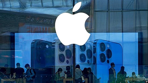 FILE - People check out the latest iPhone 13 handsets at an Apple Store in Beijing, China, Sept. 28, 2021. Amazon’s audiobook service Audible and phone apps for reading the Quran and Bible have become inaccessible for users in mainland China. (AP)