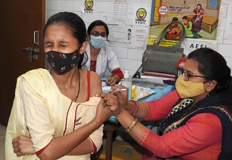 New Delhi : A health worker administers a covid vaccine dose to a teenager, in New Delhi on Saturday, April 23, 2022. (Photo: Anupam Gautam/ IANS)