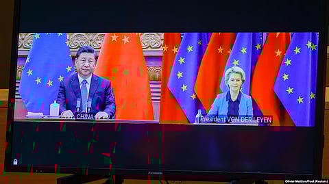Chinese leader Xi Jinping (left) and European Commission President Ursula von der Leyen speak via video conference during an EU-China summit in April. (RFE)