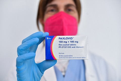 Paxlovid, which is made by Pfizer pharmaceutical company, is an oral antiviral pill that is used to treat COVID-19. (Reuters)