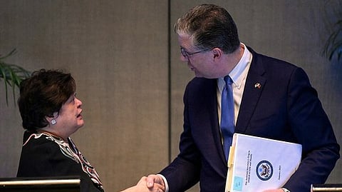 Theresa Lazaro, the Philippine Foreign Affairs acting undersecretary (left), greets U.S. Assistant Secretary of State Daniel J. Kritenbrink after speaking to reporters following the 10th U.S.-Philippines Bilateral Strategic Dialogue in Manila, Jan. 20, 2023. (Jam Sta Rosa/AFP)
