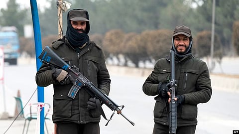 Taliban security personnel stand guard at a checkpoint along a street in Kabul on Jan. 10, 2023. (AFP)