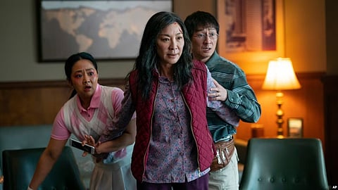 This image released by A24 Films shows, from left, Stephanie Hsu, Michelle Yeoh, and Ke Huy Quan in a scene from, "Everything Everywhere All At Once." (AP)