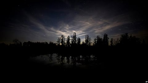FILE - A view from the camping platform on the east side of the Okefenokee National Wildlife Refuge picks up light pollution from the southeast of the refuge, March 30, 2022, in Folkston, Ga. (AP)