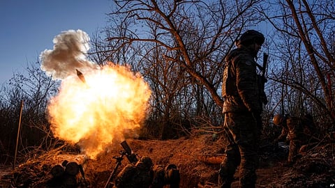 Ukrainian servicemen fire a 120mm mortar towards Russian positions at the front line near Bakhmut, Donetsk region, Ukraine, Jan. 11, 2023. (AP)