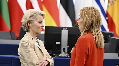 European Commission President Ursula von der Leyen speaks with European Parliament President Roberta Metsola prior a debate on the results of the war of aggression by Russia against Ukraine, at the European Parliament in Strasbourg, Feb. 15, 2023. (AFP)