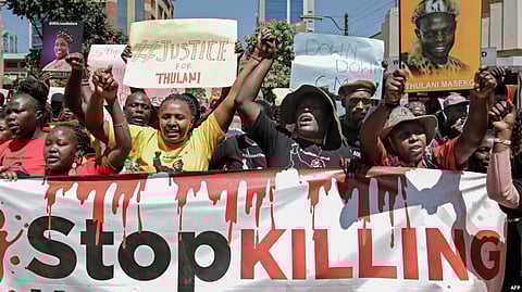 FILE - Members of various human rights Defender groups protest the brutal killing of renowned human rights lawyer Thulani Maseko at his home in Eswatini in Nairobi, Kenya, on Jan. 30, 2023. (AFP)