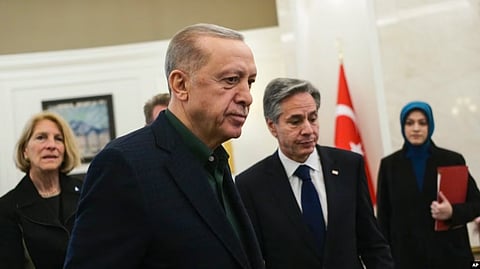 Turkish President Recep Tayyip Erdogan, left, talks to U.S. Secretary of State Antony Blinken during their meeting at Esenboga airport in Ankara, Turkey, Feb. 20, 2023.