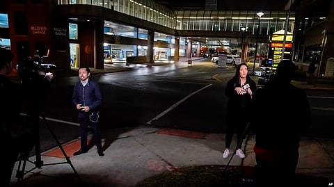 Television reporters broadcast in front of the University of Cincinnati Medical Center, in Cincinnati, Ohio, Jan. 2, 2023. (AP)