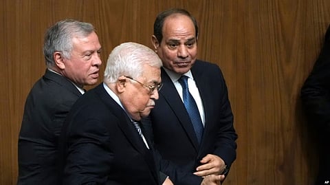 Egyptian President Abdel-Fattah el-Sissi, right, greets Palestinian President Mahmoud Abbas, center, and King Abdullah II of Jordan, during a conference to support Jerusalem at the Arab League headquarters in Cairo, Feb. 12, 2023. (AP)