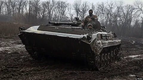 Ukrainian service members ride inside an infantry fighting vehicle near the frontline town of Bakhmut, amid Russia's attack on Ukraine, in Donetsk region, Ukraine Feb. 25, 2023. (Reuters)