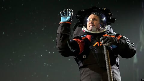 Axiom Space chief engineer Jim Stein demonstrates a prototype spacesuit, March 15, 2023, in Houston. (AP)