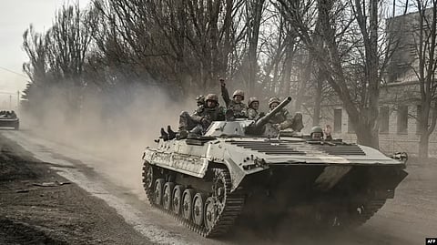 Ukrainian service members head toward Bakhmut in a BMP infantry fighting vehicle, in eastern Ukraine on March 22, 2023.