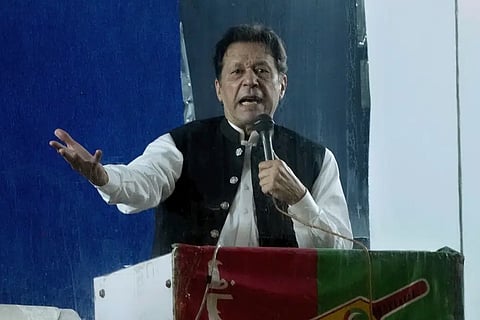 Imran Khan spoke to thousands of party supporters on a damp night in Lahore from a bulletproof box perched atop a shipping container.