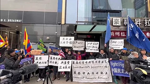 Protesters gather outside a Chinese "police service station" in New York's Chinatown district on Saturday, Feb. 25, 2023, to demand an end to spying on the Chinese community in New York. (RFA)