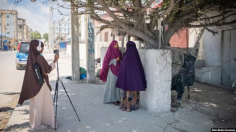 Journalists from the Somali women-led newsroom Bilan are seen on assignment. (UNDP/2022/Said Fadhaye)