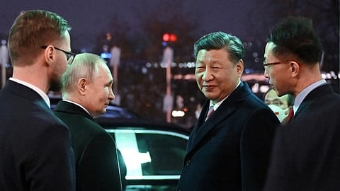 Russian President Vladimir Putin and Chinese President Xi Jinping leave after a reception at the Kremlin in honor of the Chinese leader's visit to Moscow, March 21, 2023. (Sputnik/Grigory Sysoev/Kremlin via Reuters)