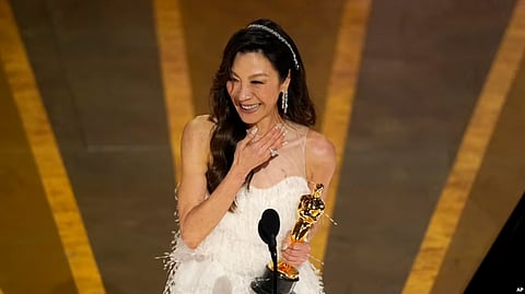 Michelle Yeoh accepts the award for best performance by an actress in a leading role for 'Everything Everywhere All at Once' at the Oscars on March 12, 2023, at the Dolby Theatre in Los Angeles. (AP)