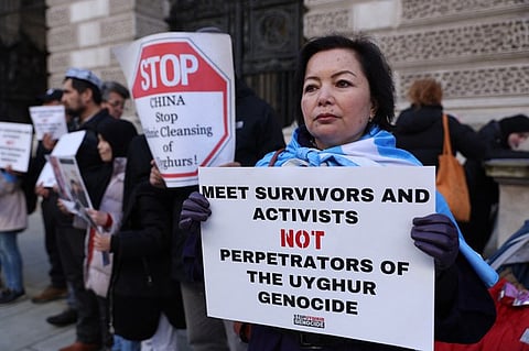 Chinese government was committing genocide against Uyghurs in Xinjiang, though it did not compel the British government to act to recognize it.