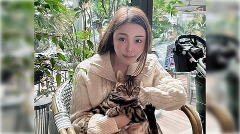 Model Abby Choi, 28, poses for a photo on Feb. 11, 2023, in Hong Kong. (Pao Jo-yee via AP)