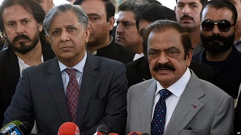Pakistan's Interior Minister Rana Sanaullah, right, and Law Minister Azam Nazeer Tarar, left, speak to media outside the Supreme Court in Islamabad, Pakistan, on April 4, 2023.